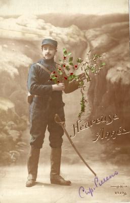 Beeld- en postzijde nieuwjaarskaart, soldaat met hulst- en maretak, 1915