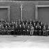 Fotoreportage 'Huldiging van gedecoreerden door firma Vandemoortele': groep gedecoreerden met baas en gouverneur, Izegem 1957